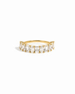Oval and emerald cut stackable ring on white background