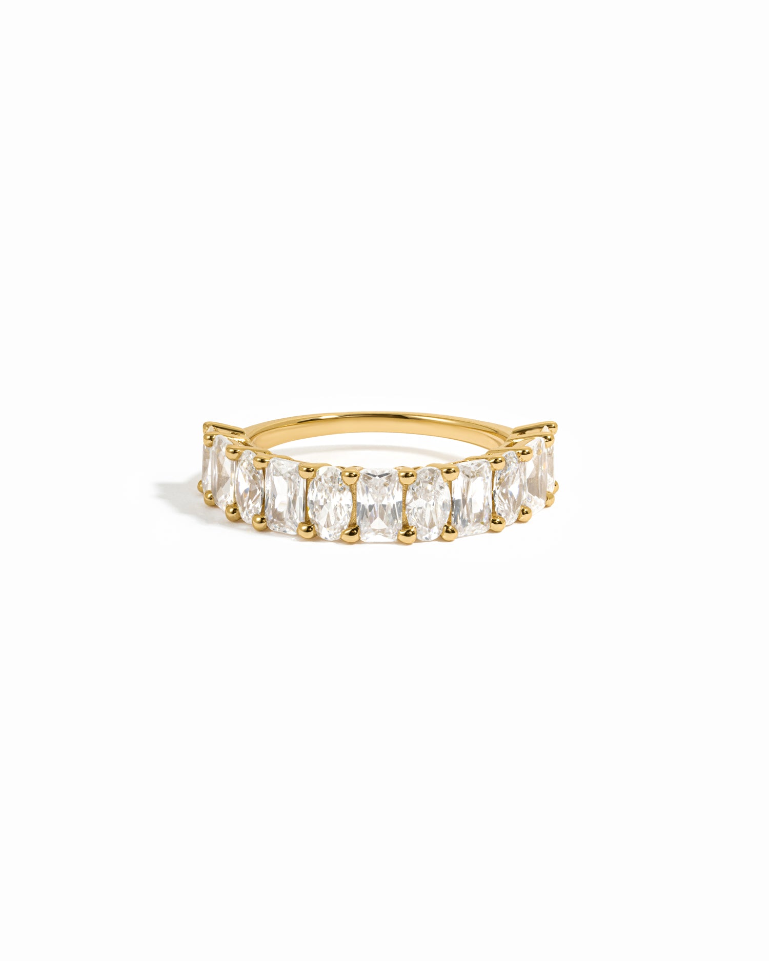 Oval and emerald cut stackable ring on white background