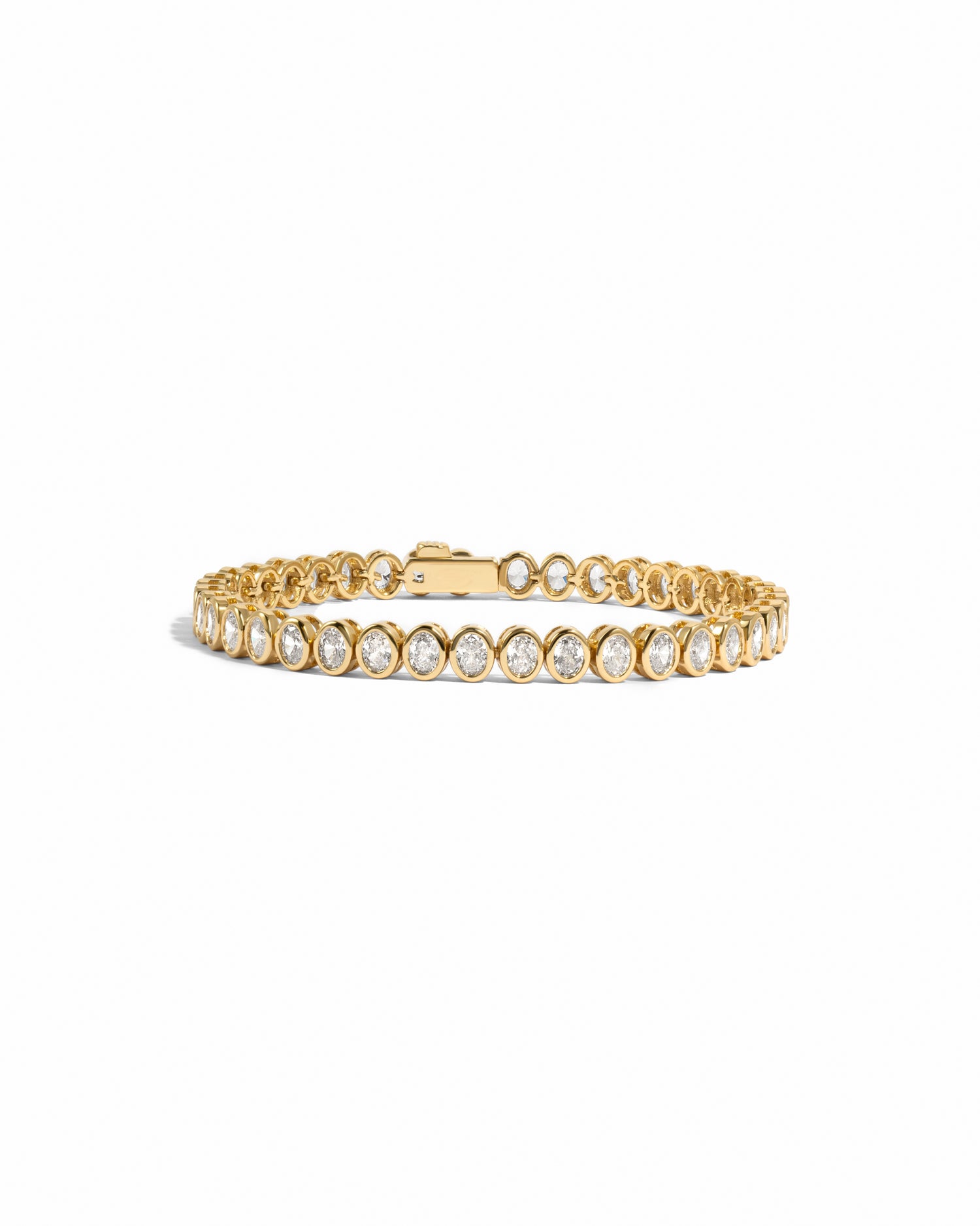 oval diamond tennis bracelet with bezel set stones