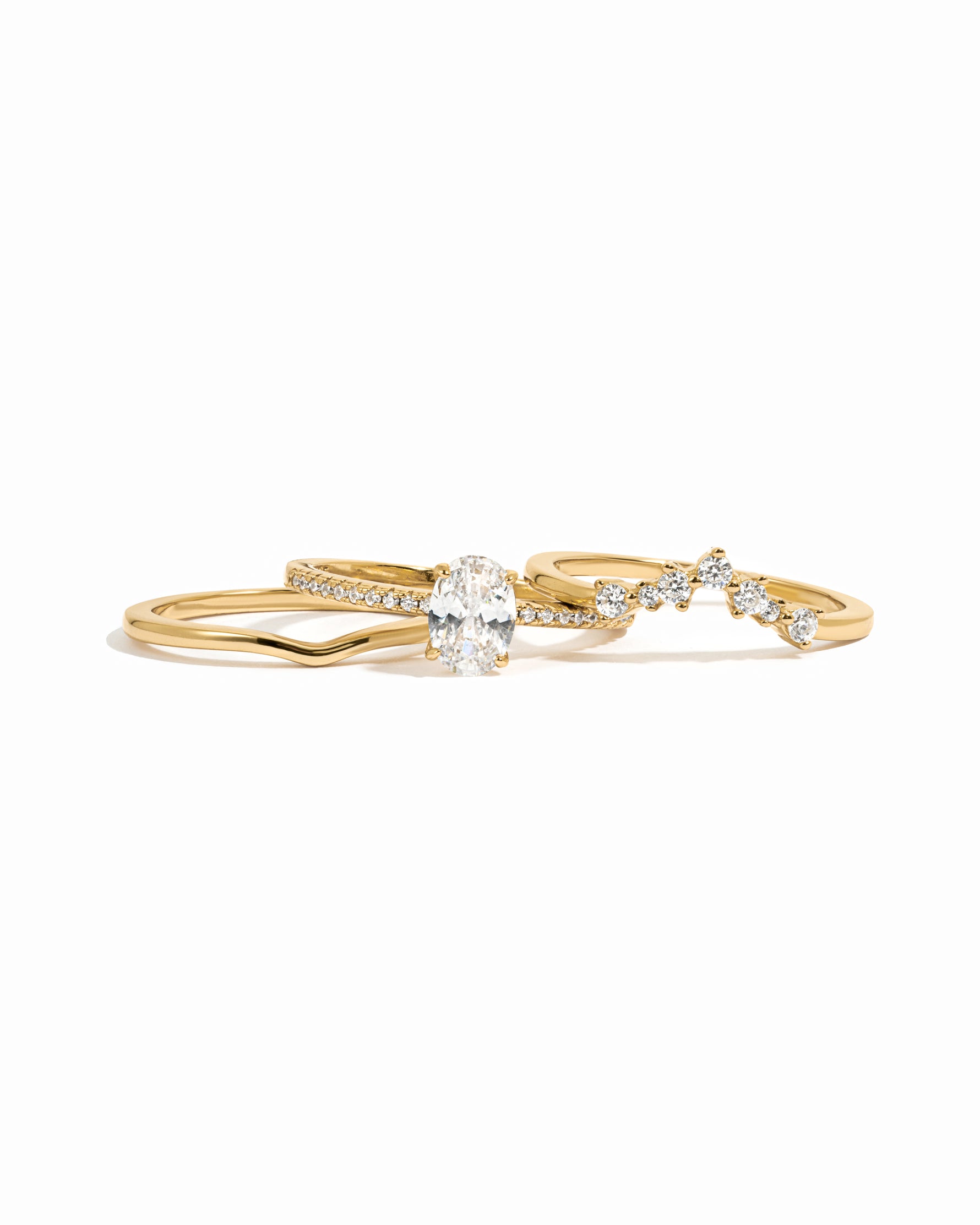 Gold wedding ring set on a white background
