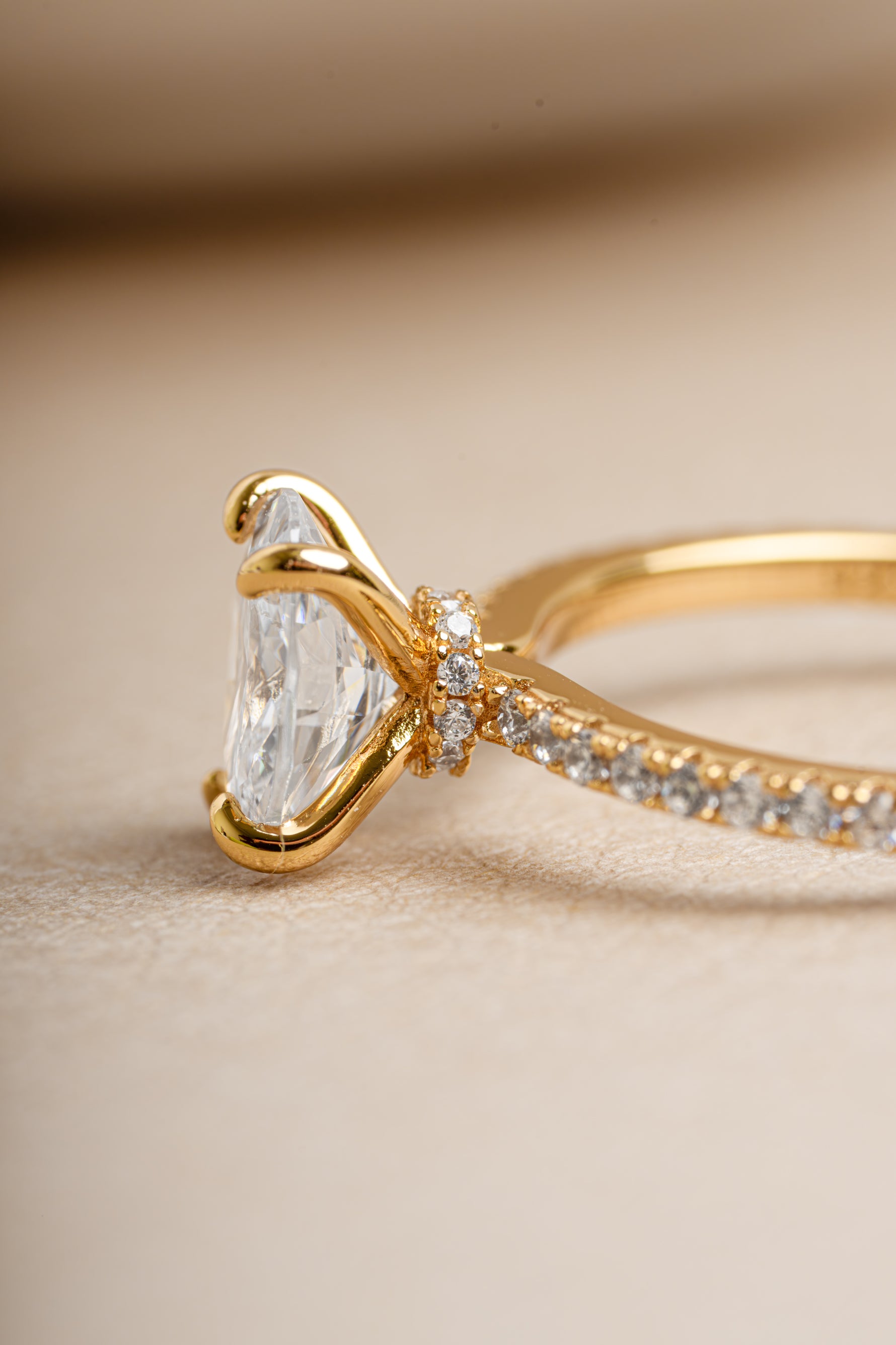 Side view of bridal jewelry featuring a  gold diamond promise ring 
