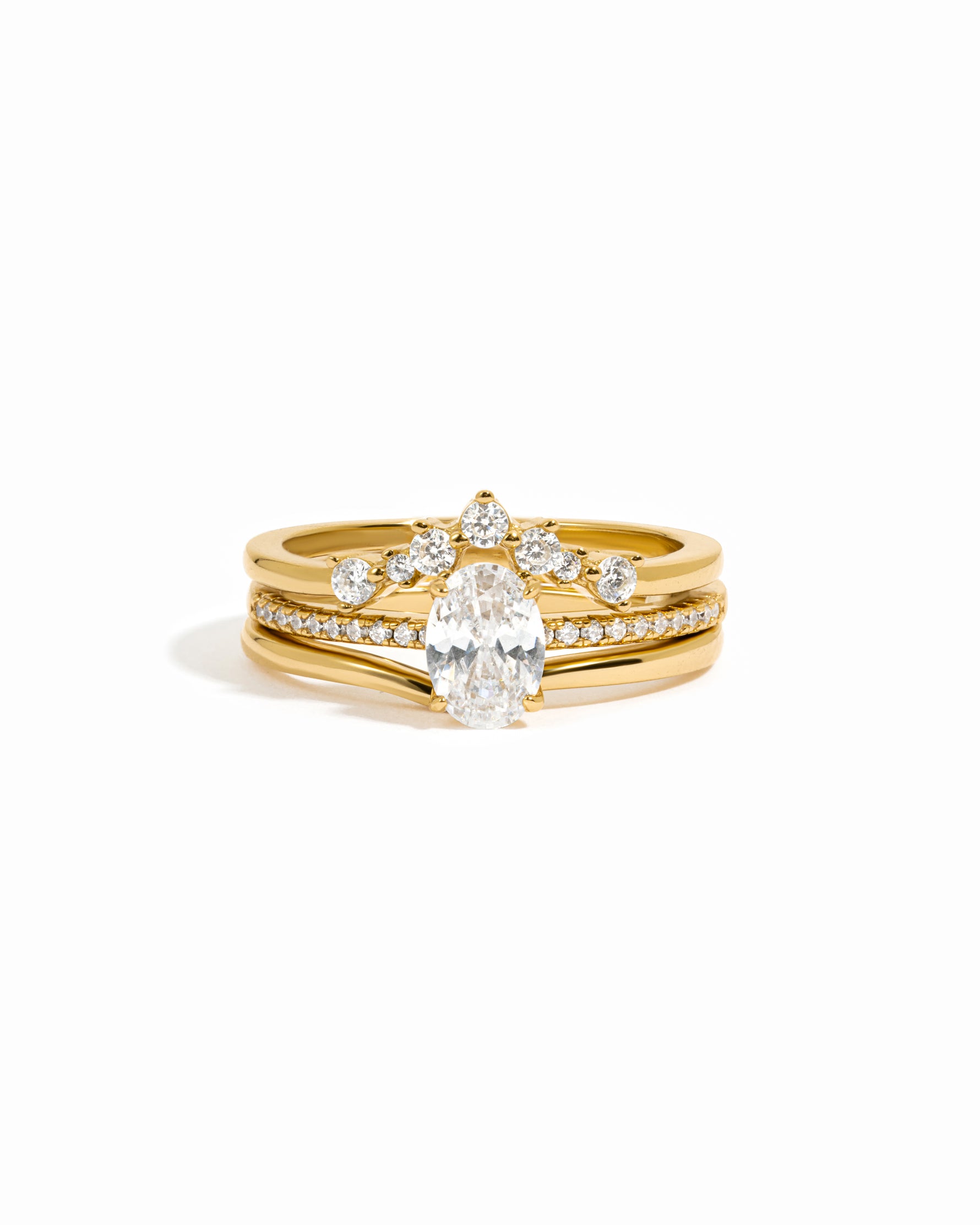 Gold diamond ring set on a white background