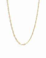 Gold chain necklace on a white background