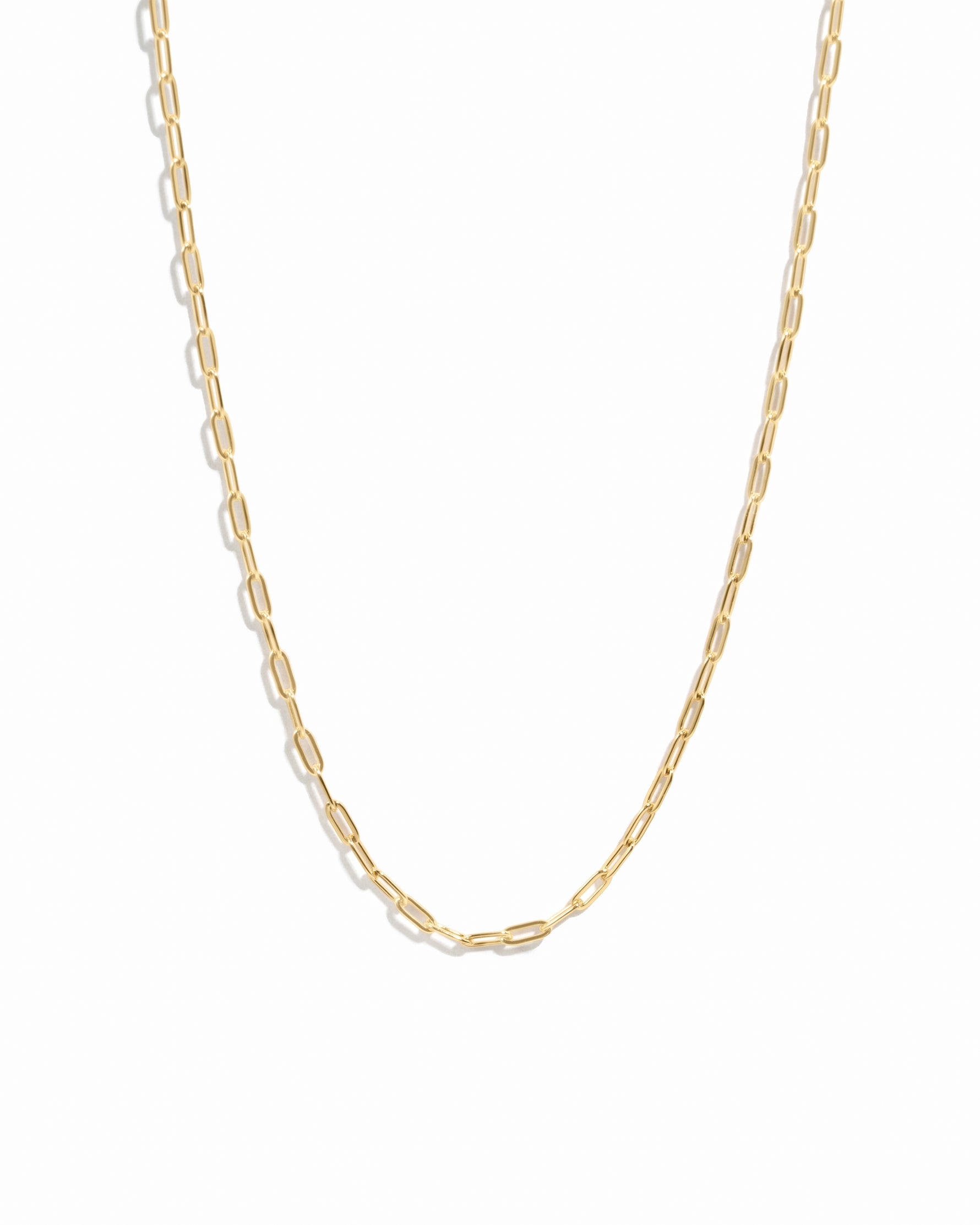 Gold chain necklace on a white background