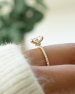 Side view of gold stackable diamond ring on model