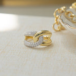 Closeup image of sterling silver criss cross ring with 14k gold plating