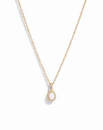 Gold opal tear drop pendant necklace.