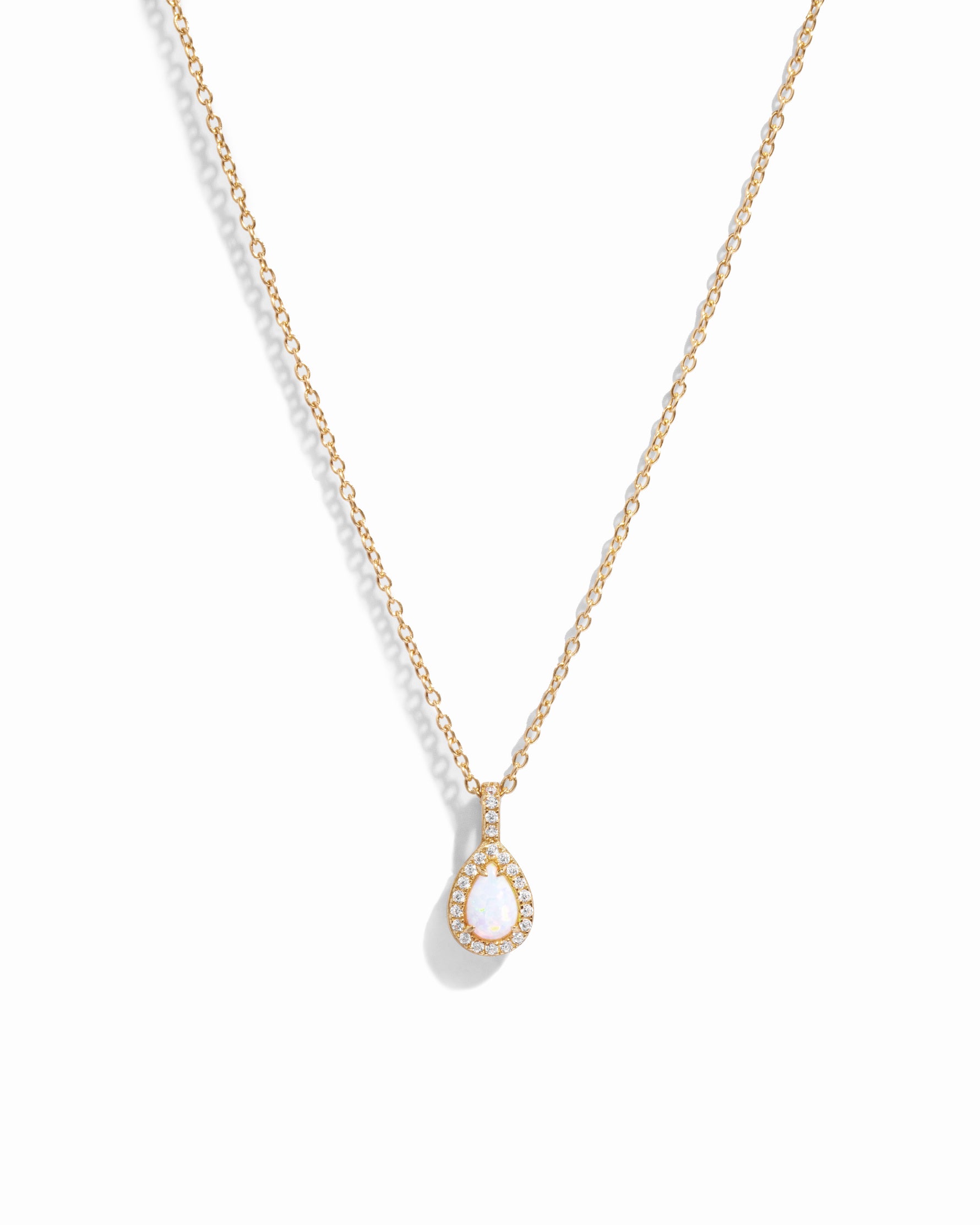 Gold opal tear drop pendant necklace.
