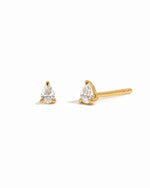 Gold stud earrings on a white background 
