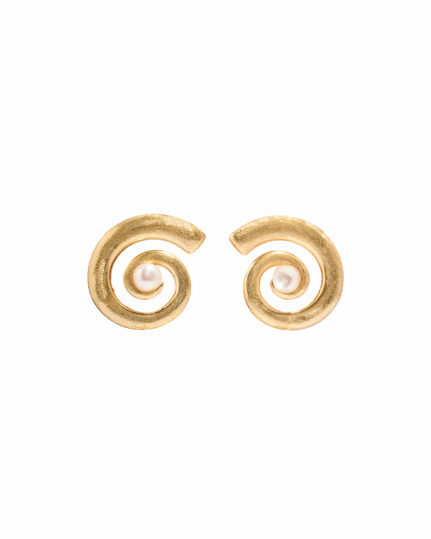 closeup image of gold and pearl earrings