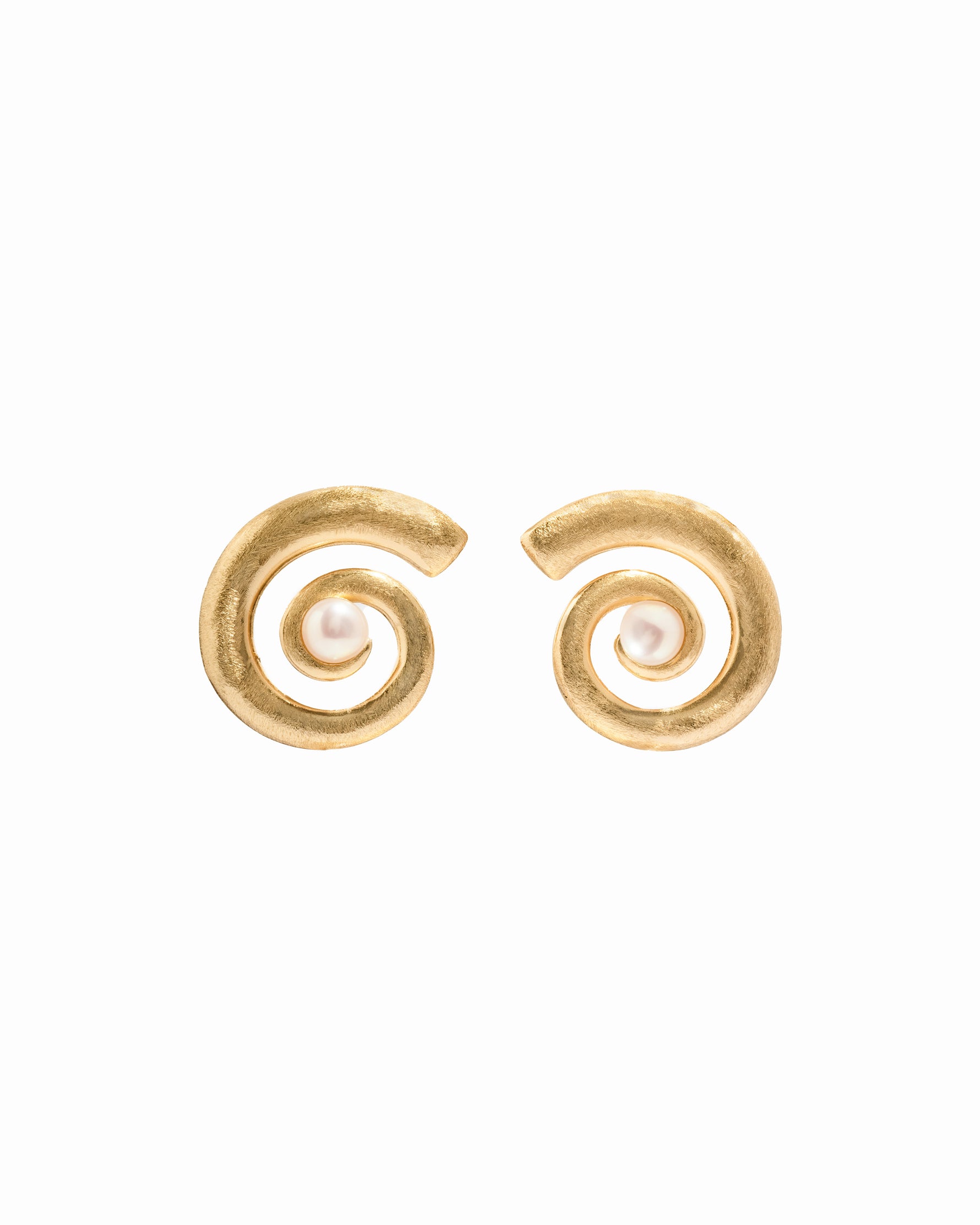 closeup image of gold and pearl earrings