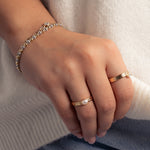 image of model wearing minimalist jewelry featuring dainty pearl ring