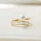 gold statement ring with wrap ring design and freshwater pearls