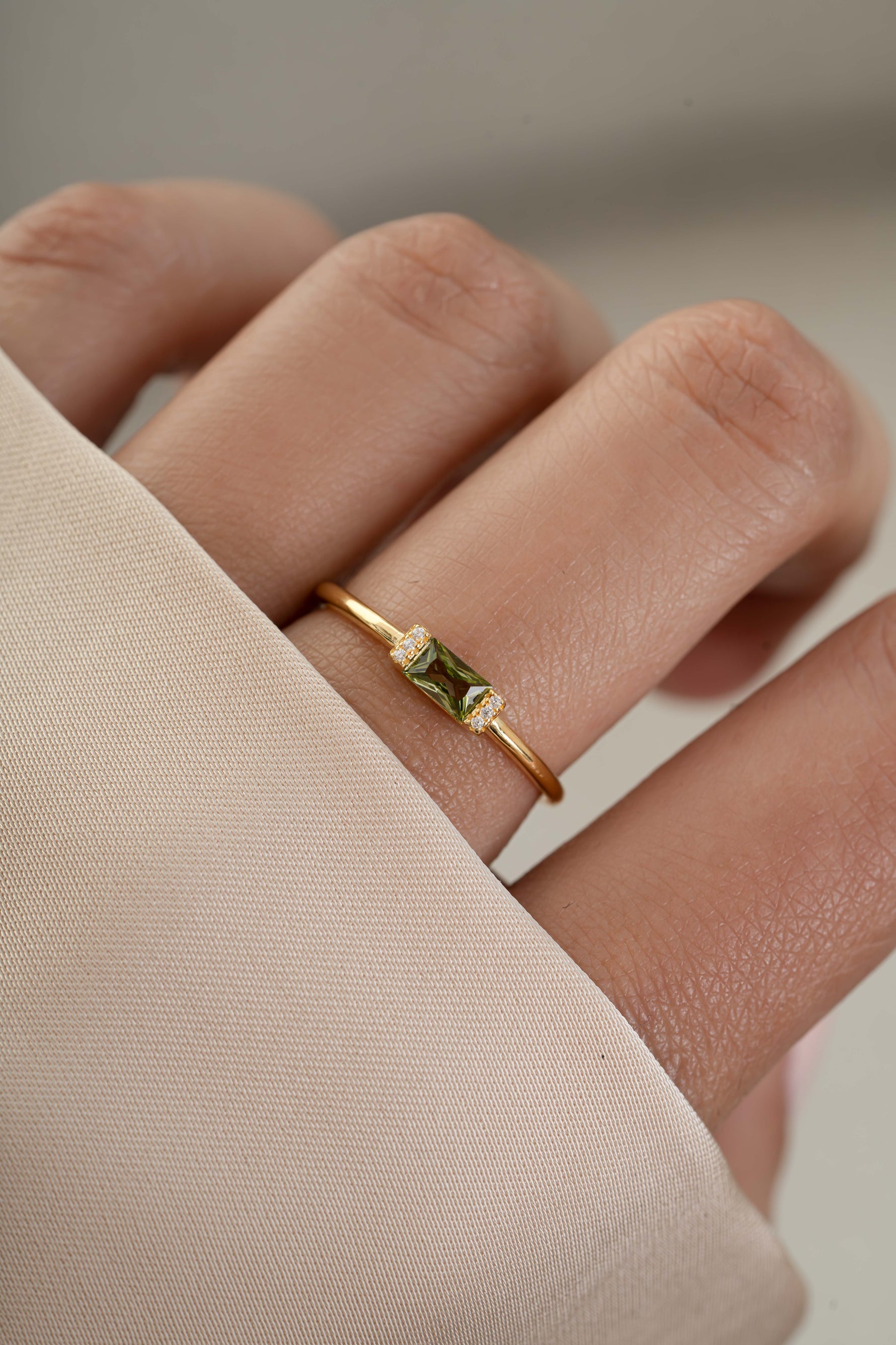 Gold peridot diamond stacking ring on model