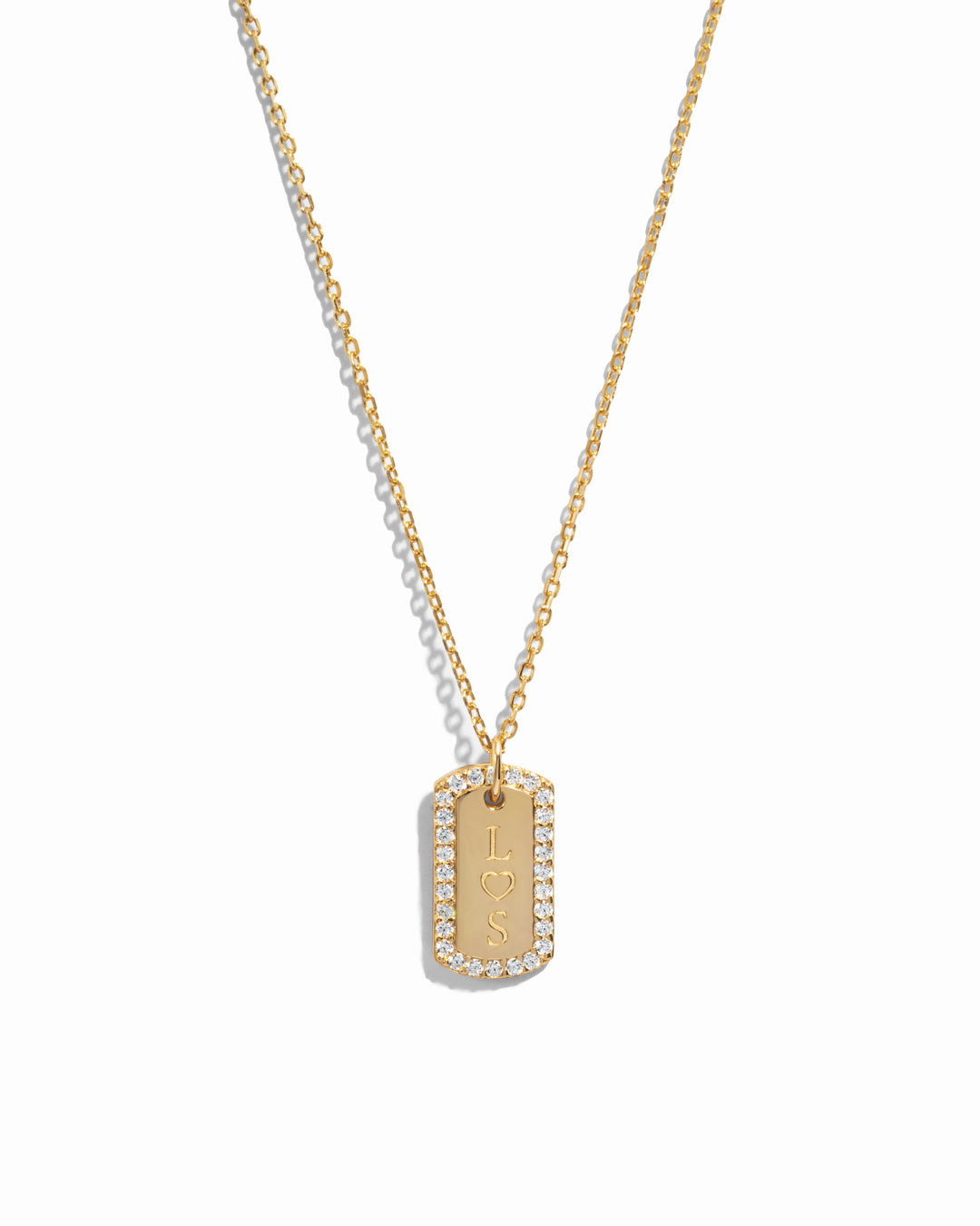 gold custom jewelry featuring a custom necklace with initials on pendant over a white background 