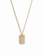 gold custom jewelry featuring a custom necklace with initials on pendant over a white background 