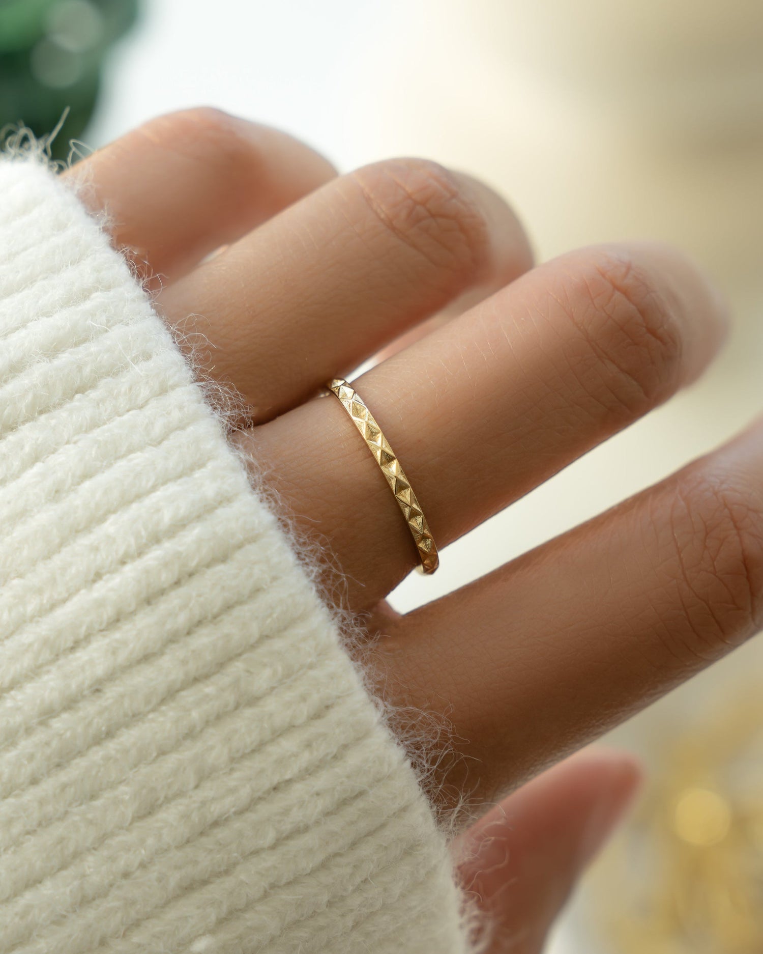 Gold stacking ring on model