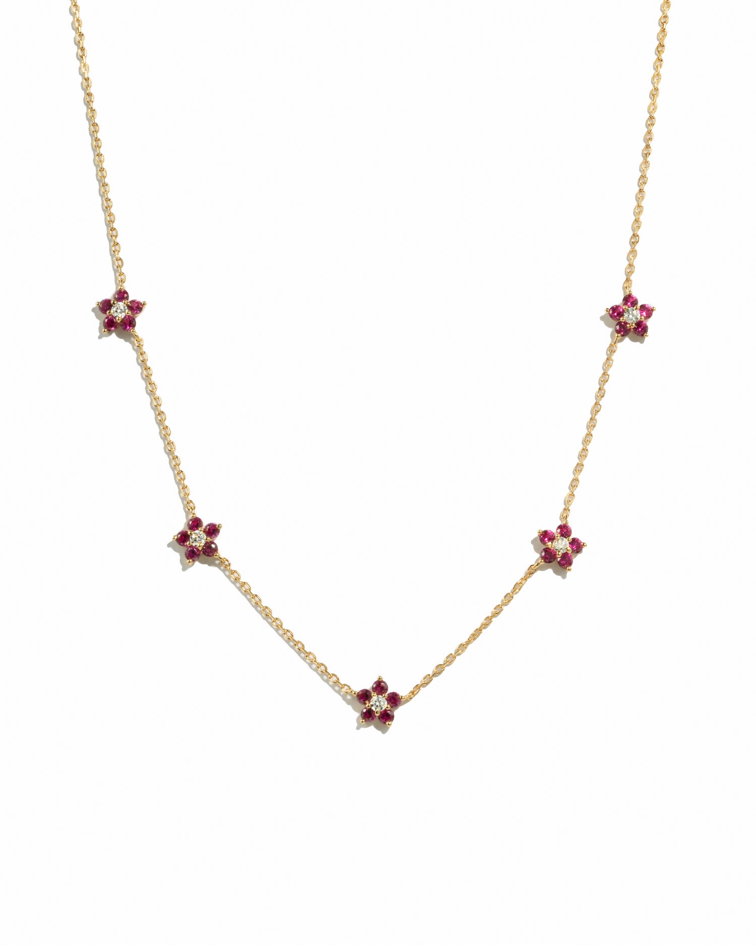 gold chain with five ruby birthstone flower pendants