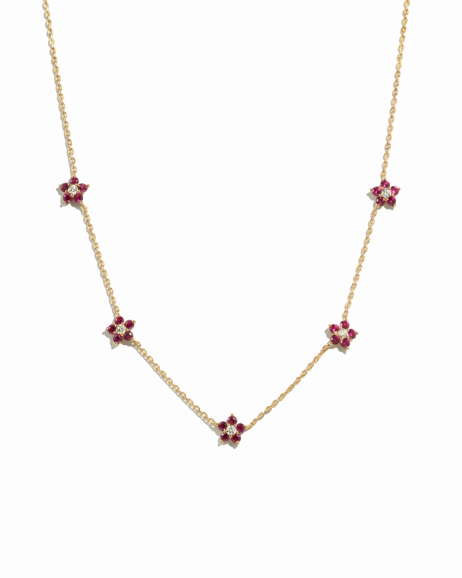 gold chain with five ruby birthstone flower pendants