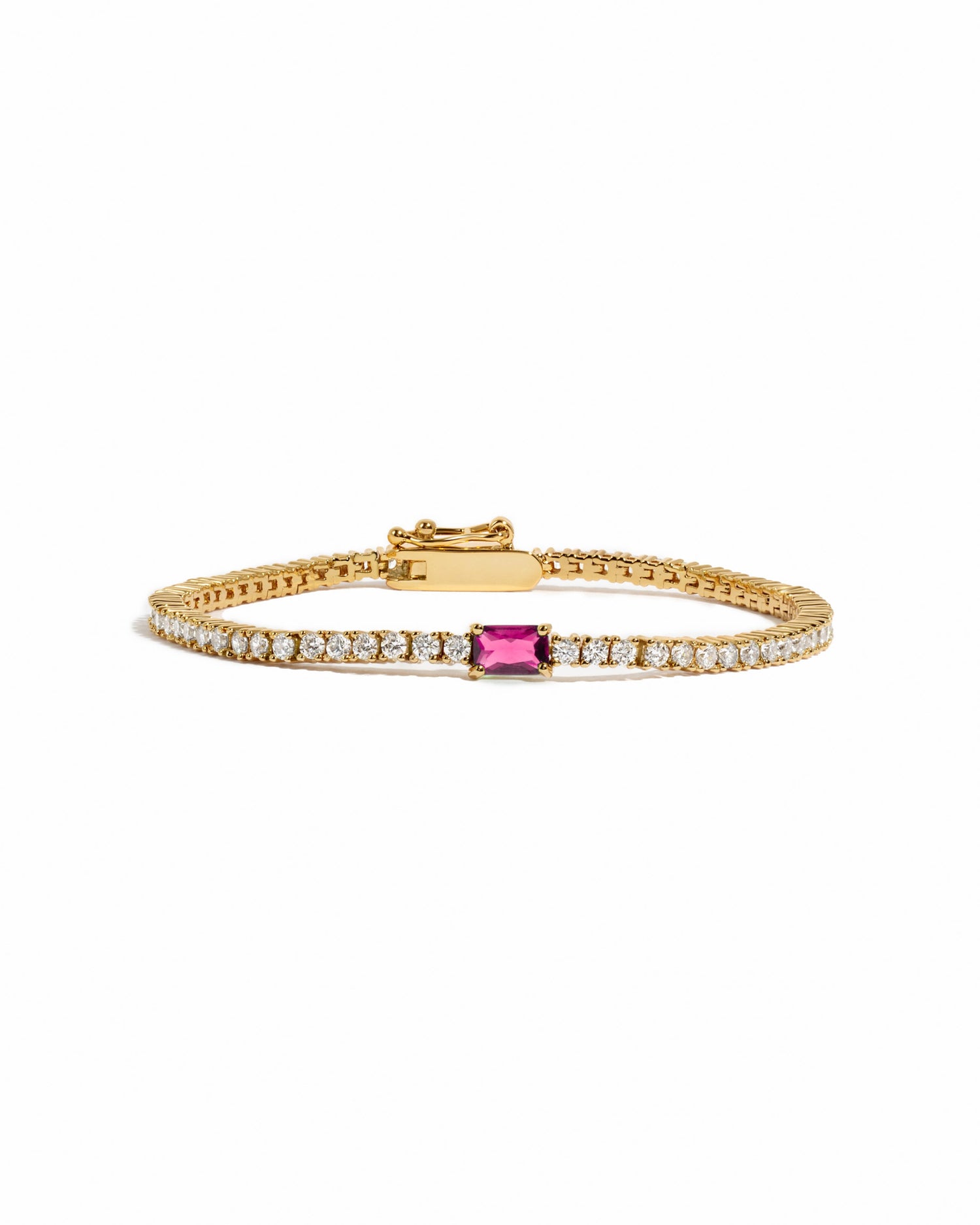 gold tennis bracelet with cubic zirconias stones and a ruby baguette birthstone in the center