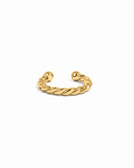 Gold ear cuff on a white background