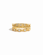 Three gold plated stacking rings on a white background