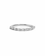 Silver ring with small pear-cut diamonds on a white background