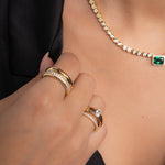 model wearing chunky gold jewelry featuring chunky gold ring 