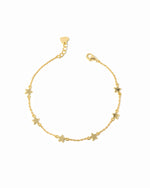 Star charm ankle bracelet on a white background 