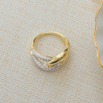 Closeup image of 14k gold plated infinity ring with two tone ring design