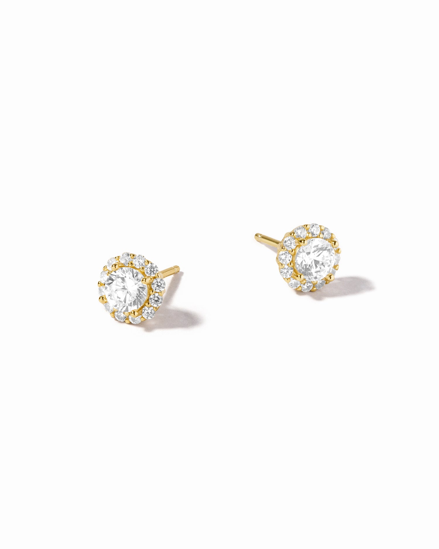 Gold diamond bridal earrings on a white background