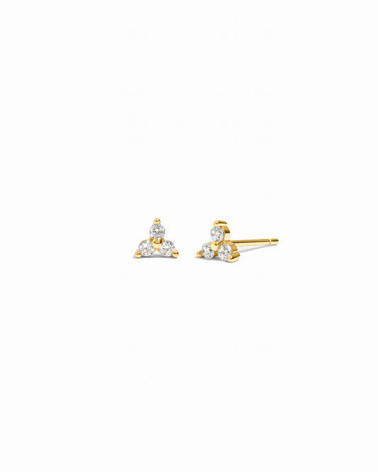 a pair of gold 3 stone stud earrings