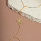 gold chain ring bracelet with cubic zirconia stones in the center