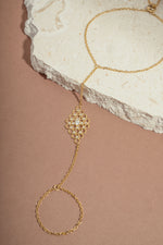 gold chain ring bracelet with cubic zirconia stones in the center