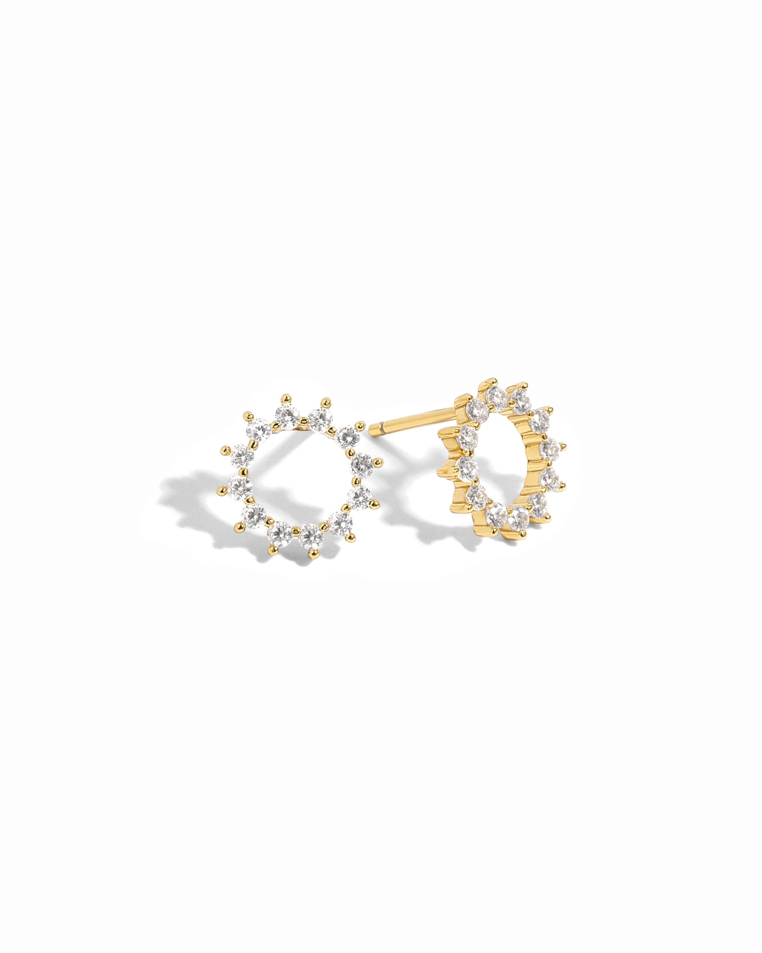 pair of gold sunburst diamond stud earrings