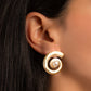 model wearing pearl earrings featuring a swirl earring design