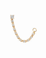 Gold earrings with diamond cz stones on a white background