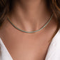 model wearing silver bezel-set turquoise tennis necklace