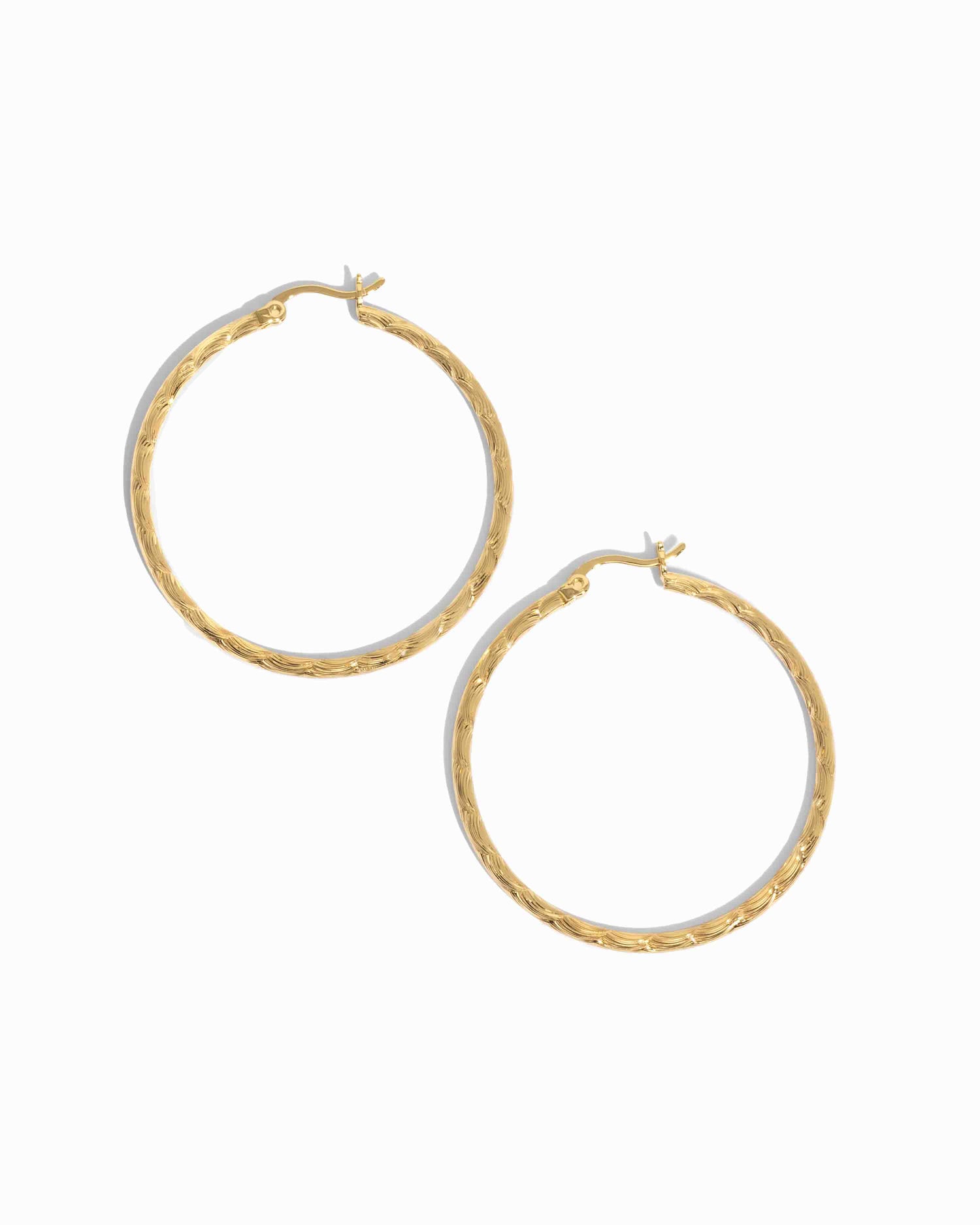 35mm gold textured hoop earrings with hammered twisted finish, lightweight vintage-inspired hoops for daily wear on a white background