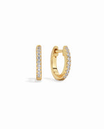 Gold hoop earrings on a white background