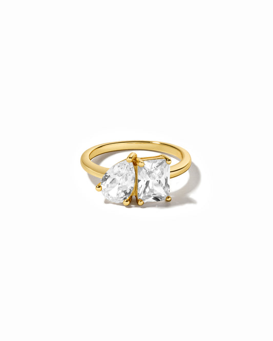 gold pear-cut and emerald-cut diamond ring