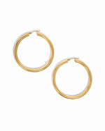 Gold chunky statement tube hoops.