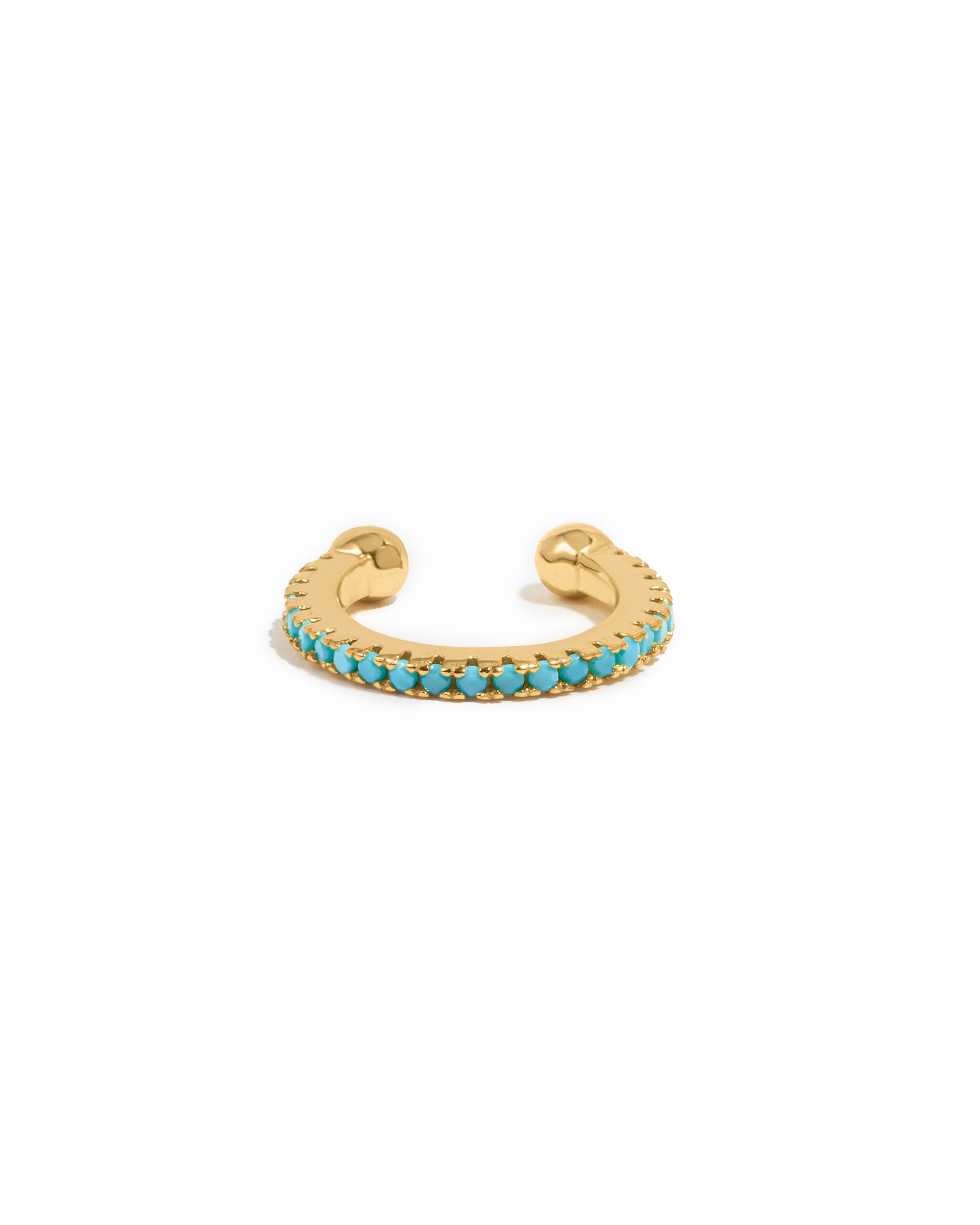 Gold ear cuff with turquoise gemstones