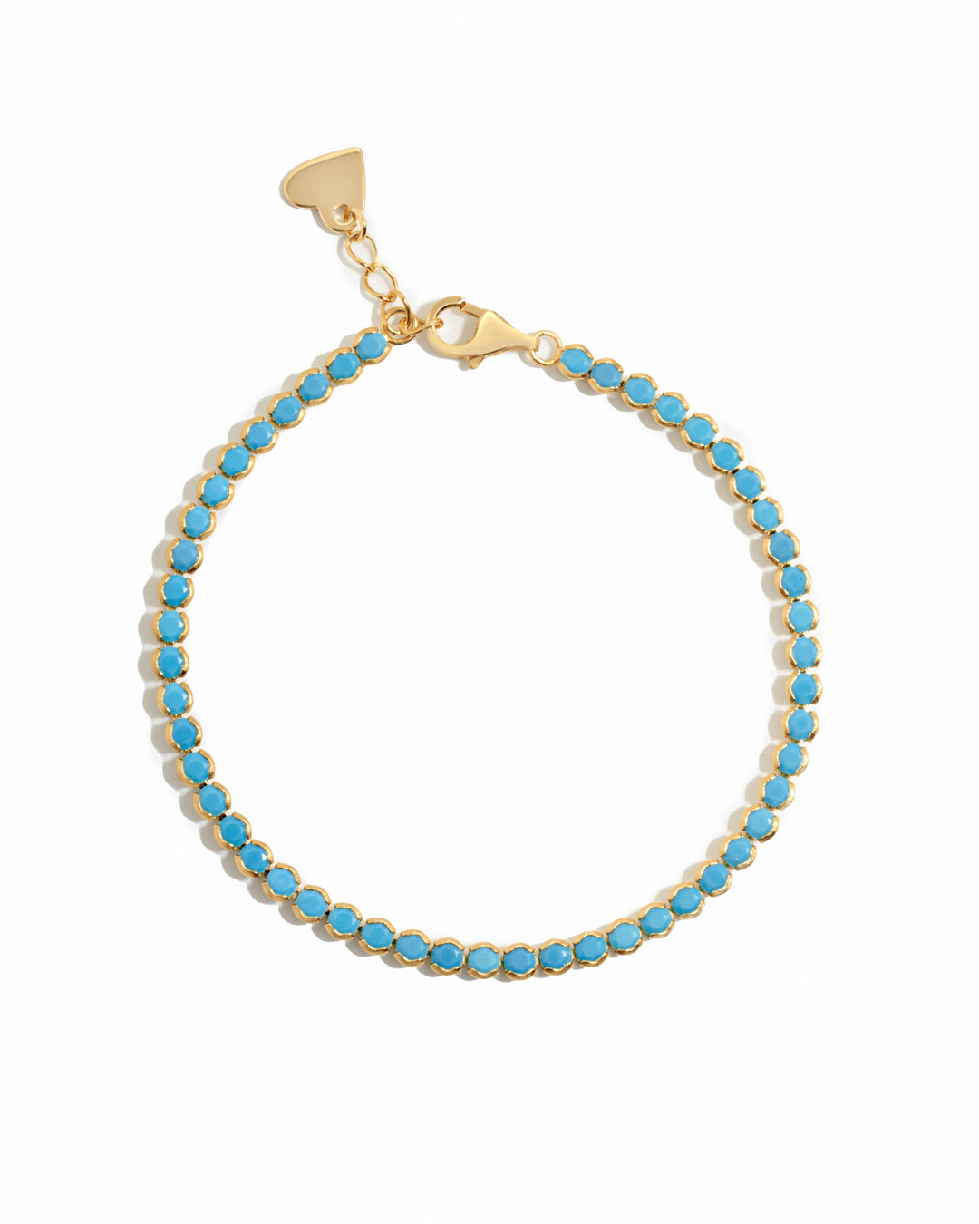 gold turquoise tennis bracelet on a white background