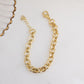 Flatlay image of gold chain bracelet