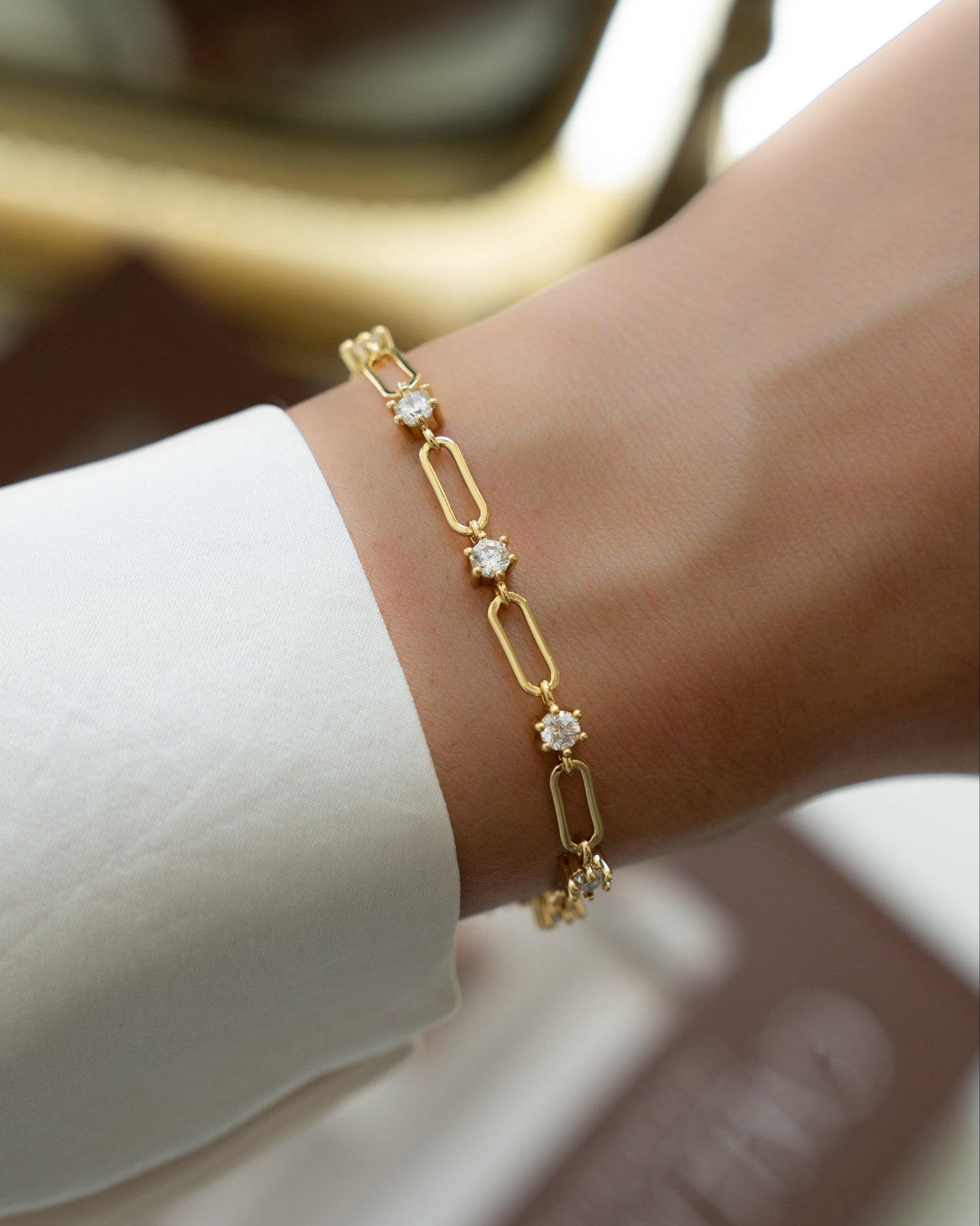 Gold chain bracelet on model