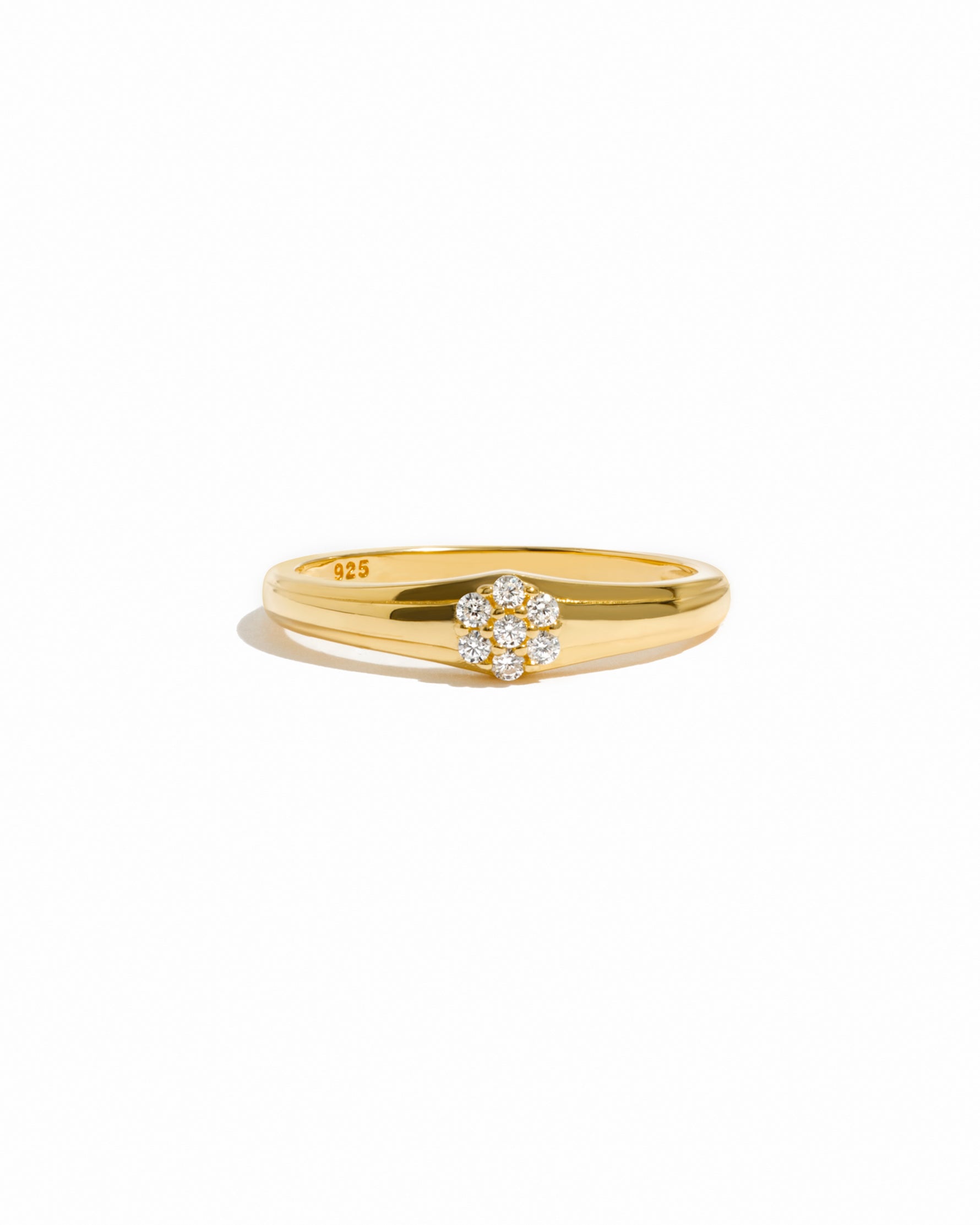 Gold vintage stacking ring on a white background