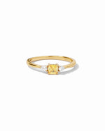 yellow cushion gemstone on gold band ring
