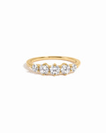 Gold diamond ring on white background