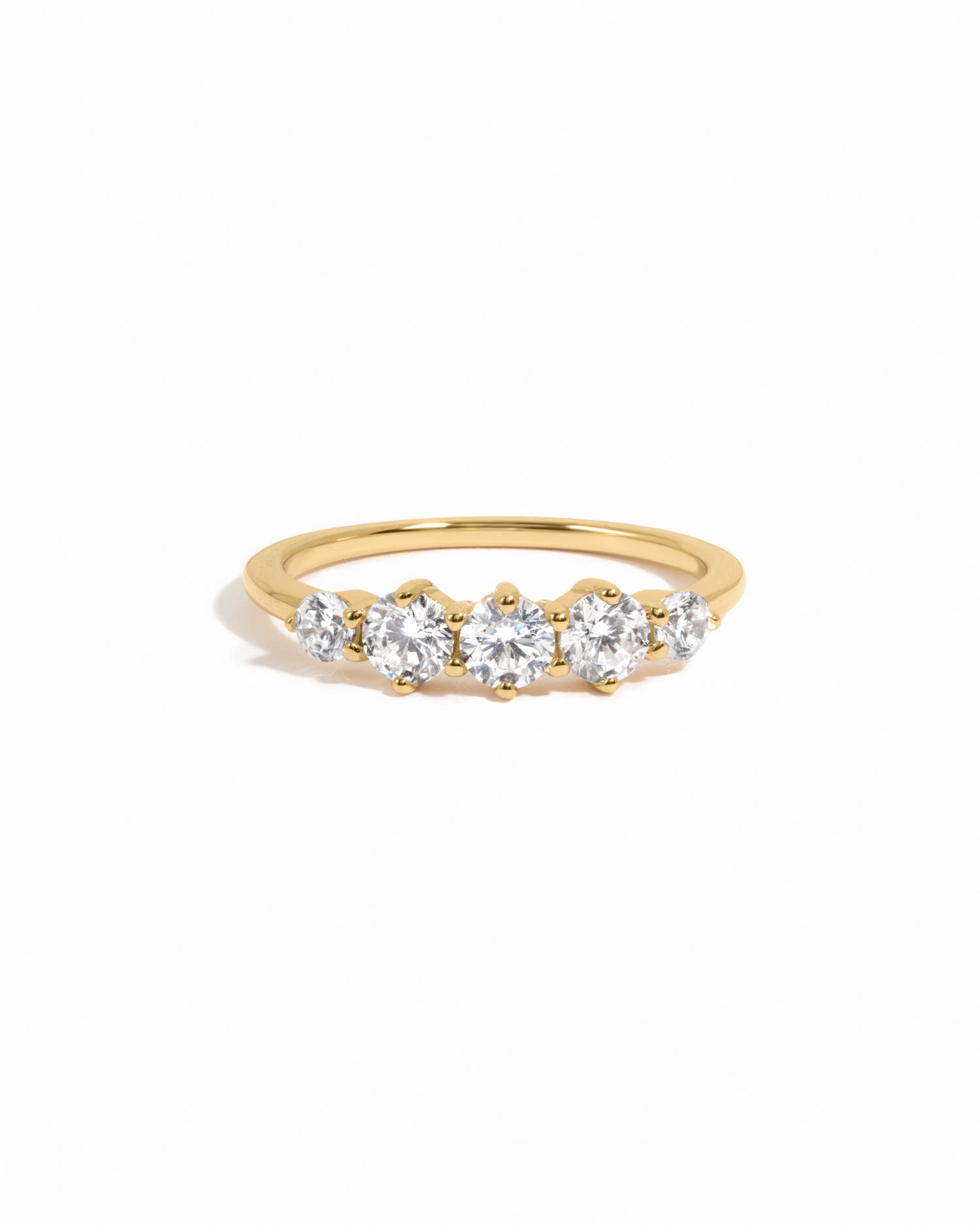 Gold diamond ring on white background